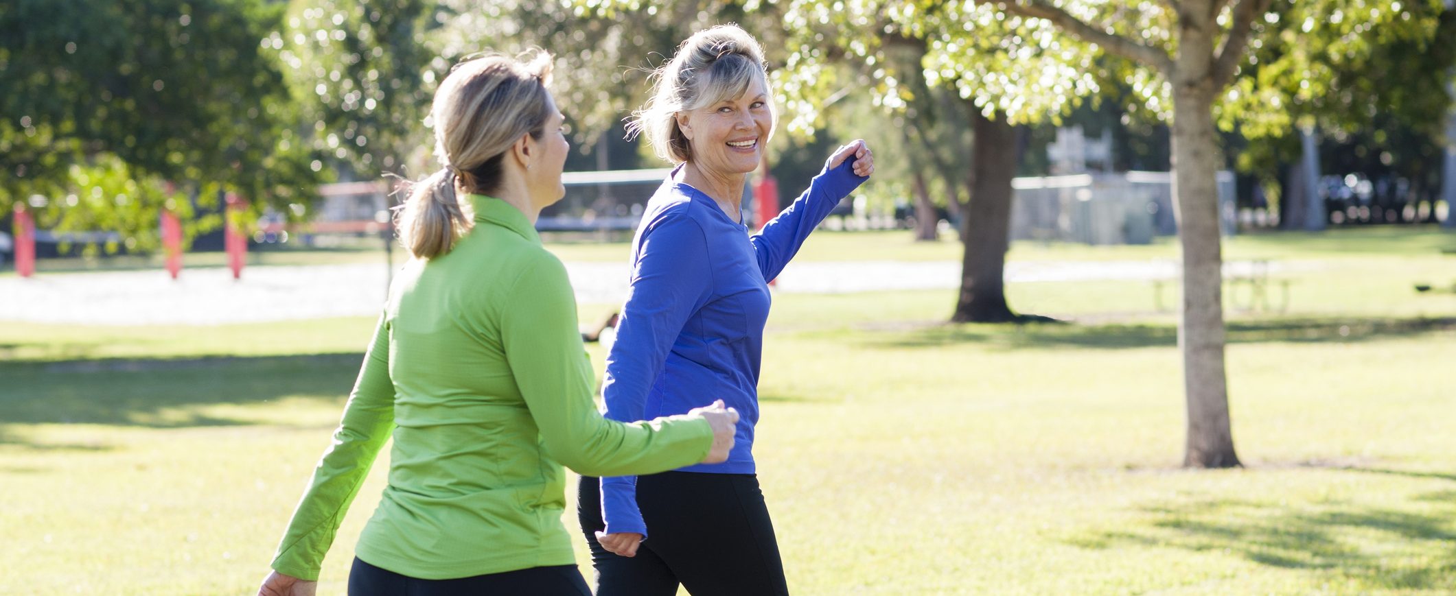 Two women staying active by walking regularly