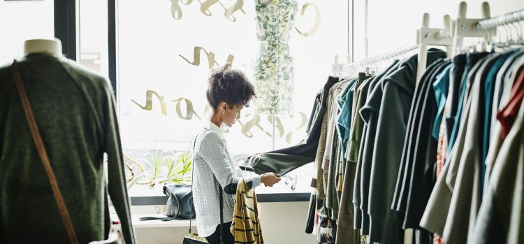 A woman shopping for clothes focuses on quality over quantity