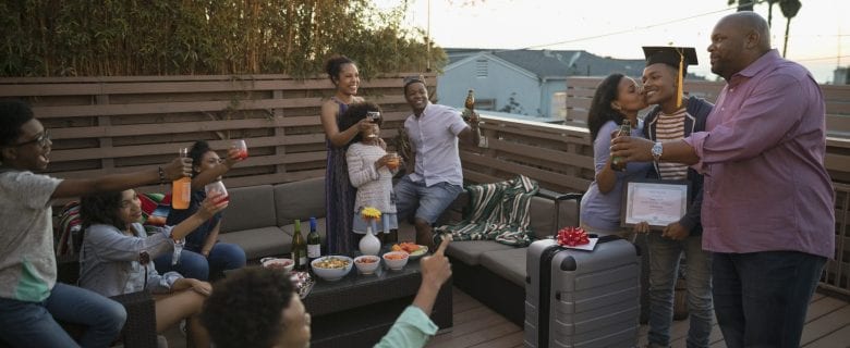 Celebratory gathering where loved ones raise a toast to a new graduate