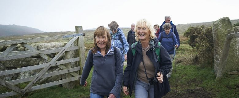 A group of friends enjoy a hike in the countryside.