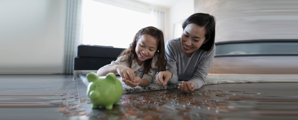 Mother and daughter counting change